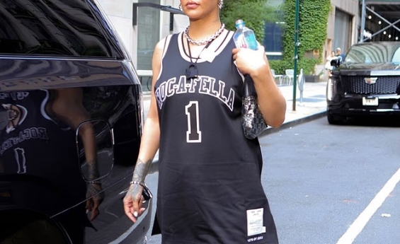 RIHANNA SUPPORTS JAY-Z WITH ROCAFELLA JERSEY AT HIS CONCERT